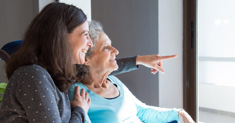 What are the early signs of dementia? Woman taking care of elderly mother with dementia